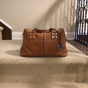 Michael Kors medium size satchel purse. Saddle color